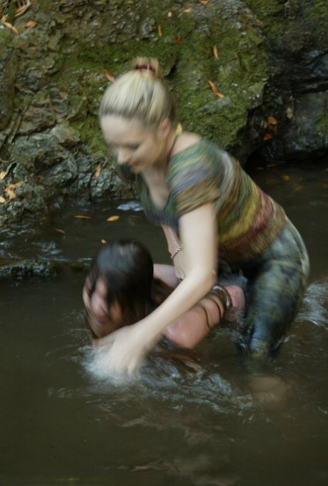 Busty virgin gets schooled by a blonde lezdom in outdoor water bondage action