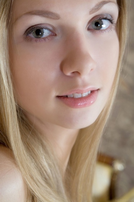 Teen with a beautiful smile Augusta Crystal shows her plump ass & yummy pussy