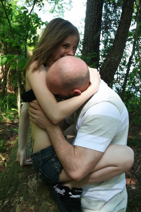 Brunette babe Lil Candy gets stripped and fucked hard in the woods