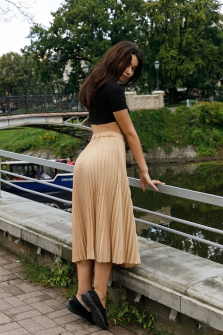 Adorable amateur Miki Pedangen poses clothed in public & flashes an upskirt