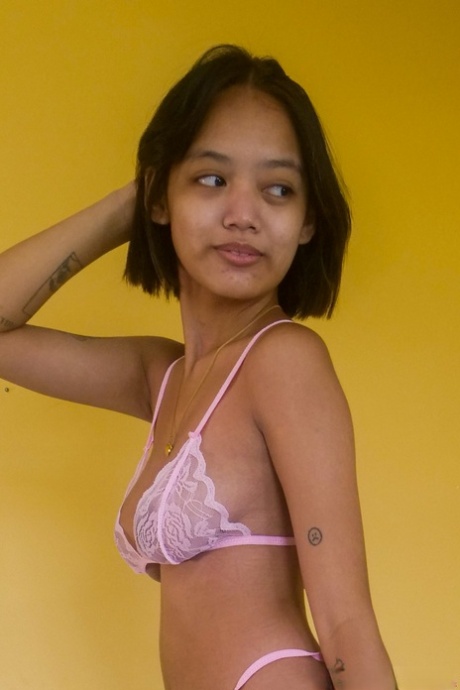 Brunette Asian teen Gabriella Fuentes exposes her big nips and tits in a solo